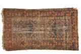 Antique Malayer rug: allover Herati design, meandering vine border in madder and navy blue, aged patina.