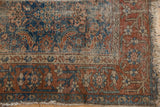 Antique Malayer rug's worn madder root border, Herati motif field, and tattered fringe.