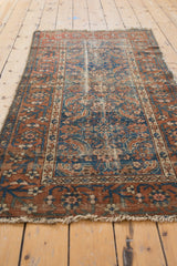 Antique Malayer rug field showing Herati motif, worn pile, madder root and navy tones.