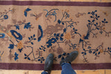 Vintage Nichols Art Deco runner detail: sprawling blue vinery, bird motif, and faint foundation.