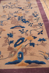 Angled view of beige Nichols Art Deco runner, blue bird and sprawling vinery.