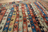 Textured, hand-knotted pile of an antique Kurdish runner with colorful, ribboned boteh motif stripes.