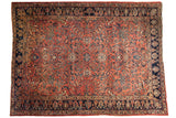 Time-softened Lilihan carpet, dusty raspberry field, expressive floral motifs, navy blue border, 9'1