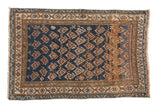 Antique Kurdish rug, circa 1910s, with staggered geometric boteh on abrashed indigo ground.