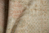 Distressed hand-knotted Oushak rug pile with soft blush, mint green, and coffee tones.