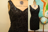 Vintage 80s little black sequin dress featuring a V-neck and short hem.