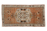 Distressed Oushak rug runner with roundel medallion, floral bouquets, copper, slate blue, and ivory. 2'7