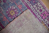 Distressed pile showing foundation and intricate hand-knotted weave of a Vintage Oushak rug.