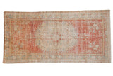 Vintage distressed Turkish Oushak runner, faded cherry red medallion and ivory vinery, 3'3