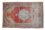 Distressed Oushak rug with faded red medallion, pale blue details, neutral field. 3'6