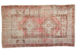 Vintage distressed Oushak rug with faded blush and sand geometric double medallions, 2'11