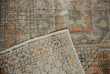 Backside detail of a distressed Oushak rug, showing its hand-knotted foundation and worn pile.