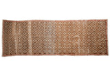 Distressed vintage Oushak runner with coffee brown, ivory, and blush floral lattice pattern.