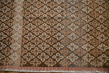 Oushak runner's distressed floral pattern with coffee, ivory, charcoal hues and blush selvage.