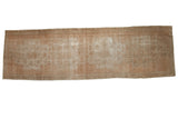 Distressed Oushak rug runner, featuring faded medallions and muted sand-beige tones, 3'8