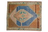Distressed Oushak square rug, faded blue diamond medallion, geometric floral bouquet, abrashed brown ground.