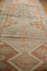Distressed pile texture of copper and grey stylized motifs on a vintage Oushak runner.