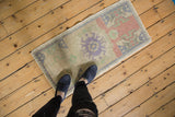 Distressed vintage Oushak rug with faded crab medallion and textural abrash.