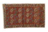 Distressed Oushak rug featuring chestnut, ivory, and teal germinating floral motifs. 1'8