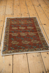Distressed Oushak rug pile featuring chestnut, ivory, and copper germinating floral motifs.