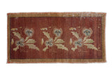 Distressed Oushak hand-knotted runner with repeating floral bouquet on a copper red field.