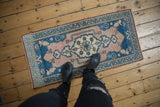 Pale sapphire blue and dusty rose patterns on a distressed Oushak runner underfoot.
