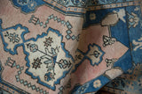 Vintage Distressed Oushak runner with textured pale blue and dusty rose meandering floral motifs.