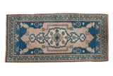 Distressed vintage Oushak rug runner with pale blue medallion and dusty rose field. 1'10