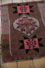 Curvilinear floral details and starburst geometric pattern with pink selvage.