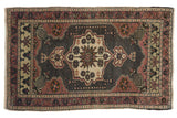 Distressed vintage Oushak rug with oxidized silver field, dusty mauve starburst medallion, vine border. 2'x3'2