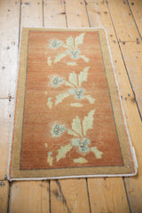 Textured copper field of Oushak runner with powder blue floral sprays.