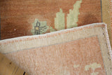 Vintage Oushak rug showing hand-knotted foundation and copper pile with even wear.