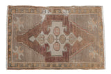Distressed vintage Oushak rug, primitive geometric medallion, quatrefoil blossoms, abrashed silver, mauve, ivory.