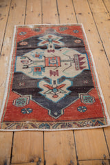 Distressed Oushak rug: central germinating tree of life motif in rust, turquoise, charcoal, beige.