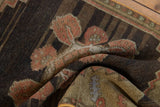 Distressed Oushak rug texture with faded dusty rose primitive floral patterns.