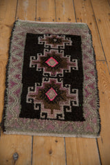 Vintage distressed Kars rug showing original side cord selvage and mauve border texture.