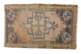 Vintage distressed Oushak rug mat with a stepped medallion, mauve, beige, blue, and brown, 1'6