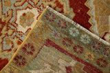 Visible hand-knotted foundation and distressed cherry red, beige Oushak rug pile.