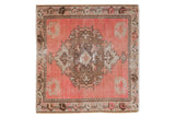 Distressed vintage Oushak square rug mat featuring pink, brown, and beige floral motifs, 2'3