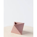 Geometric concrete mini air plant holder with pale pink and rose tones.