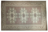 Vintage Distressed Oushak rug, faded mauve field, primitive triple starburst medallions, 7'5