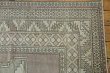 Vintage Distressed Oushak corner with serrated leaf and pawn borders, showing muted mauve.