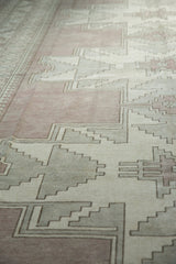 Distressed Oushak carpet with primitive stepped design in mauve and oxidized silver.