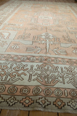 Distressed Oushak rug pile texture with pale copper geometric motifs and even wear.