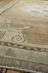 Vintage distressed Oushak carpet border, stylized ram's horn floral scrolls and abrash.