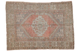 Distressed Turkish Oushak rug with stepped diamond medallion, dusty rose, time-softened silver, beige.