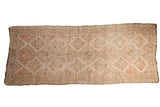 Distressed vintage Oushak runner, faded diamond pattern in ivory, beige, oxidized silver tones.