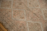 Distressed vintage Oushak runner pile texture in muted ivory, beige, and soft silver.