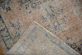 Hand-knotted foundation and weave on the reverse of a vintage distressed Oushak rug.