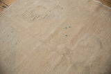 Reverse of a vintage Oushak runner showing the hand-knotted foundation and blue processing marks.